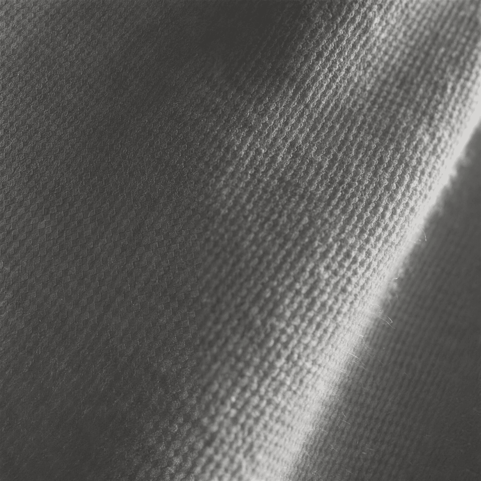 Macro in bianco e nero della trama di una maglia in cashmere